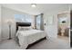 Inviting bedroom with large windows, mirrors, and an attached bathroom at 1399 Flathead River Ln, Marietta, GA 30064