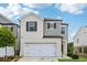 Charming two-story home with a white brick and gray siding exterior at 1399 Flathead River Ln, Marietta, GA 30064
