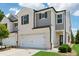 Attractive home exterior showing the garage and a neatly kept lawn at 1399 Flathead River Ln, Marietta, GA 30064
