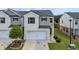 Charming two-story home featuring a two-car garage, manicured lawn, and inviting curb appeal at 1399 Flathead River Ln, Marietta, GA 30064
