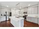Modern kitchen with stainless steel appliances and a quartz island at 1399 Flathead River Ln, Marietta, GA 30064