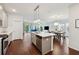 Open concept kitchen area with a large island and modern lighting at 1399 Flathead River Ln, Marietta, GA 30064