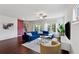 Bright living room featuring a blue sectional sofa, stylish coffee tables, and modern decor at 1399 Flathead River Ln, Marietta, GA 30064