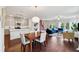 Open concept living room with dining area, kitchen, and blue sofa, perfect for entertaining at 1399 Flathead River Ln, Marietta, GA 30064