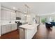 Living area with dark wood floors, with many windows for natural light at 1399 Flathead River Ln, Marietta, GA 30064