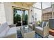 Inviting patio with comfortable seating, a stylish rug, and a view to the sliding glass doors at 1399 Flathead River Ln, Marietta, GA 30064