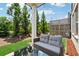 Outdoor patio with comfortable seating surrounded by green grass and trees at 1399 Flathead River Ln, Marietta, GA 30064