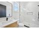 Bright bathroom features white marble tile in the glass enclosed shower and black fixtures at 3061 Bold Springs Rd, Dacula, GA 30019