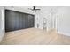 Spacious bedroom with hardwood floors, modern lighting, and a full closet at 3061 Bold Springs Rd, Dacula, GA 30019
