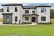 Beautiful two-story home with black framed windows and a well-manicured lawn at 3061 Bold Springs Rd, Dacula, GA 30019