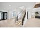 Grand foyer with staircase, hardwood floors, and views into other rooms in the home at 3061 Bold Springs Rd, Dacula, GA 30019