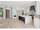 Open concept kitchen with a center island, modern appliances, and ample cabinet space at 3061 Bold Springs Rd, Dacula, GA 30019