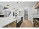 Bright, open kitchen featuring a large island, stainless steel appliances, and ample cabinet space at 3061 Bold Springs Rd, Dacula, GA 30019