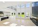 Spacious living room with lots of natural light, hardwood floors and modern fireplace at 3061 Bold Springs Rd, Dacula, GA 30019