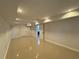Spacious basement featuring tile flooring, recessed lighting and a door to another room, offers versatility at 453 James Street Sw, Lilburn, GA 30047