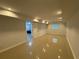 Basement area with an open door to another room and a window provides ample lighting and space at 453 James Street Sw, Lilburn, GA 30047