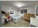 Bedroom with crib, bed, desk, and decor with inspiring wall decor at 453 James Street Sw, Lilburn, GA 30047