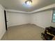 Spacious and well lit bedroom with tile flooring and one window at 453 James Street Sw, Lilburn, GA 30047