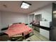 Comfortable bedroom featuring modern decor, mirrored closet, and minimalist furnishings at 453 James Street Sw, Lilburn, GA 30047