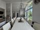Dining room featuring natural light, a large table, and modern decor at 453 James Street Sw, Lilburn, GA 30047