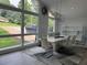 Bright dining area with modern decor, large windows with views of front yard and easy access to the kitchen at 453 James Street Sw, Lilburn, GA 30047