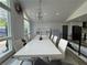 Bright dining room featuring natural light, modern decor, and seating for ten at 453 James Street Sw, Lilburn, GA 30047