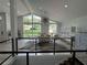 Bright dining room featuring large windows, modern decor, and seating for ten at 453 James Street Sw, Lilburn, GA 30047