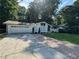 Charming one-story home with brick and siding accents, lush lawn, and an attached two-car garage at 453 James Street Sw, Lilburn, GA 30047