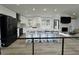 Modern kitchen featuring white cabinets, stainless steel appliances, and a large island with seating at 453 James Street Sw, Lilburn, GA 30047