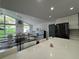 Kitchen featuring an open floor plan, white cabinets, and black appliances at 453 James Street Sw, Lilburn, GA 30047