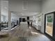 Modern kitchen with island and bar stool seating open to the living room at 453 James Street Sw, Lilburn, GA 30047