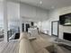 Bright open concept living area with modern kitchen and fireplace at 453 James Street Sw, Lilburn, GA 30047