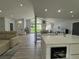 Bright living room with large windows, an open floor plan, and modern decor at 453 James Street Sw, Lilburn, GA 30047