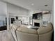Open concept living room, showcasing an adjacent modern kitchen, fireplace, and comfortable seating at 453 James Street Sw, Lilburn, GA 30047