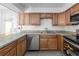 Kitchen area showcasing wood cabinets, appliances, and countertop space at 1213 Camelot Dr, Atlanta, GA 30349