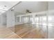 Spacious living room with hardwood floors and mirrored walls for maximum space and light at 1213 Camelot Dr, Atlanta, GA 30349