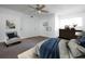 Bedroom featuring a ceiling fan, neutral walls, and a cozy sitting area at 1213 Camelot Dr, Atlanta, GA 30349