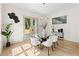 Dining room with glass table, bright lighting, and access to the backyard patio at 1238 Memorial Se Dr # A, Atlanta, GA 30316