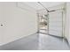 Bright two-car garage featuring epoxy floor and glass panel garage door at 1238 Memorial Se Dr # A, Atlanta, GA 30316