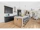 Modern kitchen with large island, stainless steel appliances and adjacent to living area at 1238 Memorial Se Dr # A, Atlanta, GA 30316