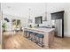 Beautiful kitchen with stainless steel appliances, modern island, and hardwood flooring at 1238 Memorial Se Dr # A, Atlanta, GA 30316