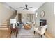 Comfortable living room with a fireplace, hardwood floors and an adjacent staircase at 1238 Memorial Se Dr # A, Atlanta, GA 30316