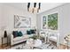 Inviting living room with elegant lighting, comfortable seating, and a view to the outdoors at 1238 Memorial Se Dr # A, Atlanta, GA 30316