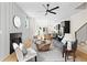 Open living area with fireplace, stairs to upper level and view to kitchen area at 1238 Memorial Se Dr # A, Atlanta, GA 30316