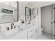 Bright bathroom featuring double vanity, quartz countertop, and modern matte black fixtures at 1238 Memorial Se Dr # A, Atlanta, GA 30316