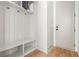 Bright mudroom featuring board and batten accent wall, storage bench and coat hooks at 1238 Memorial Se Dr # A, Atlanta, GA 30316