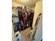 Walk-in closet with wire shelving, clothes, and personal items organized neatly at 1346 Pilgrim Lake Dr, Cumming, GA 30040