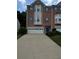 Charming brick townhome with a two-car garage and beautiful landscaping at 1346 Pilgrim Lake Dr, Cumming, GA 30040
