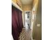 Hallway leading to laundry room and bathroom with dark wood-look floors and neutral paint at 1346 Pilgrim Lake Dr, Cumming, GA 30040