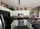 Bright kitchen with white cabinets, stainless steel appliances, and stylish decor at 1346 Pilgrim Lake Dr, Cumming, GA 30040